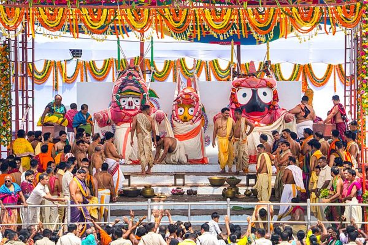 Servitors perform Snan Purnima rituals of Lord Jagannath, Balabhadra and Devi Subhadra on the Snan Bedi at the Jagannath Temple, in Puri, Wednesday, June 11, 2025. (Image Source: PTI)
