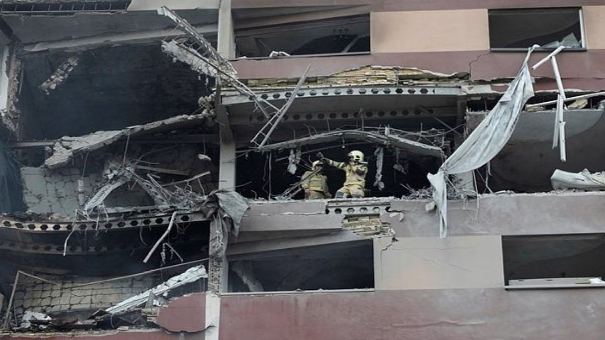 Firefighters work the scene of an explosion at a residence compound in northern Tehran, Iran, Friday, June 13, 2025. (AP Photo/Vahid Salemi)