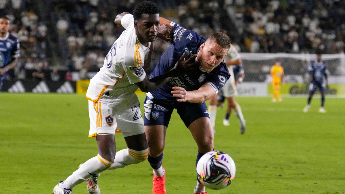 LA Galaxy defender Carlos Garcés, left, and Pachuca forward Alexandre Zurawski go after the ball during the second half of a Leagues Cup quarterfinal soccer match.