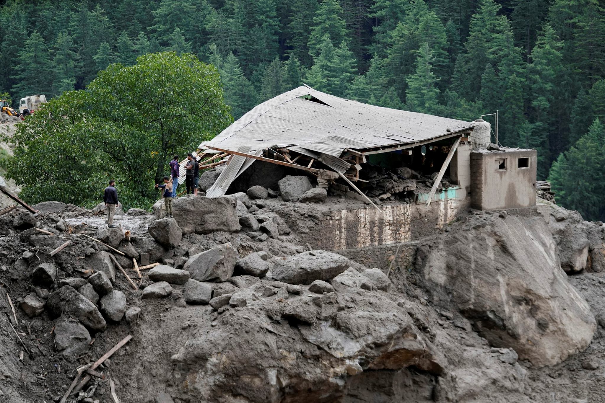 A building damaged by the flash floods is seen in Chositi village (Photo: AP)