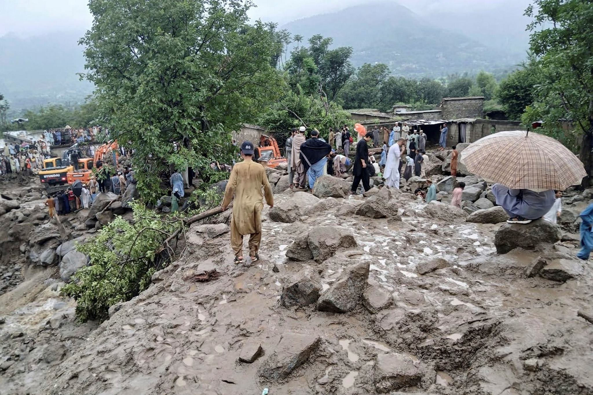 Rescuers and local residents participate in a rescue operation at the site of a massive cloudburst that led to flash flooding in Salarzai (Photo: AP/PTI)