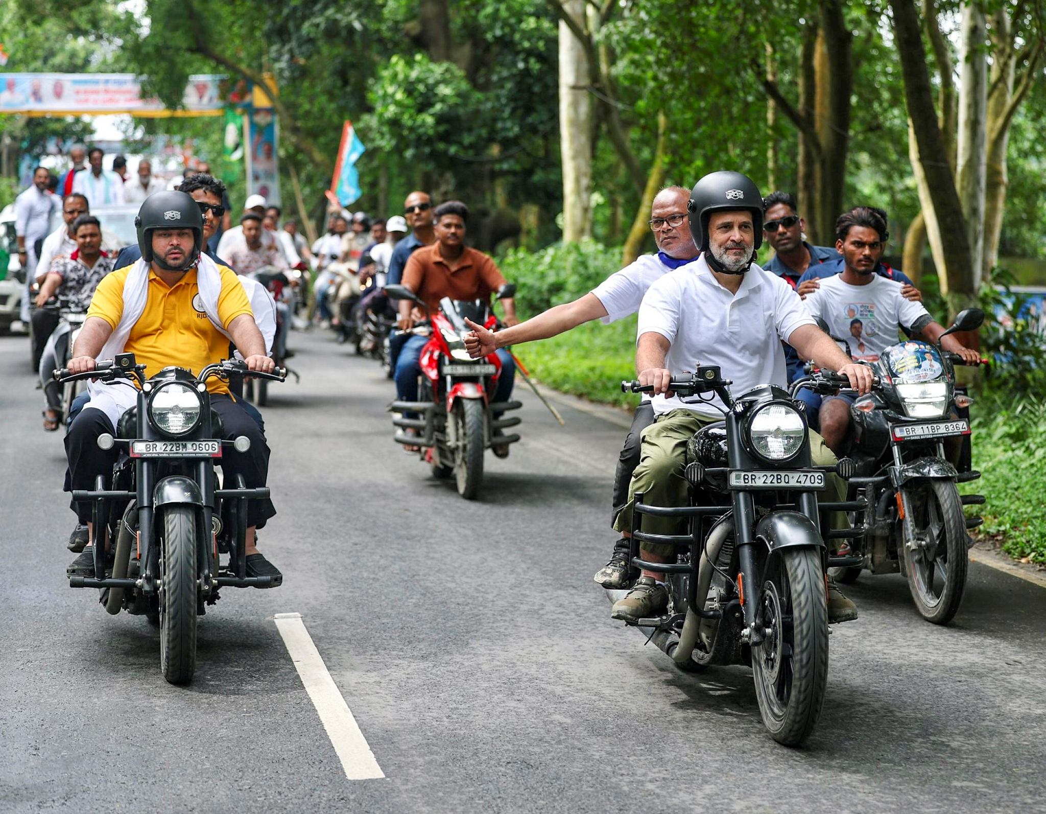 Leader of Opposition in the Lok Sabha Rahul Gandhi and RJD leader Tejashwi Yadav ride motorcycles with others during the ‘Voter Adhikar Yatra’, in Bihar. (@INCIndia/X via PTI Photo)