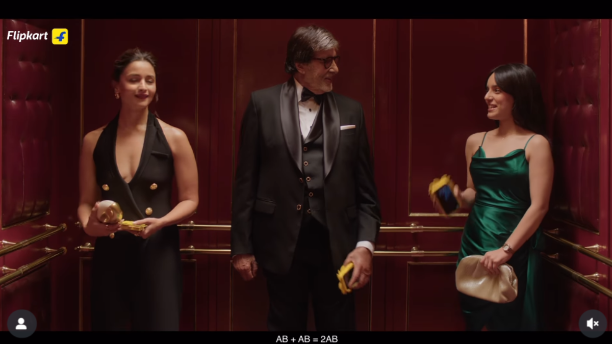 Before the surprise settles, Amitabh Bachchan steps in, also holding a phone with the identical cover.