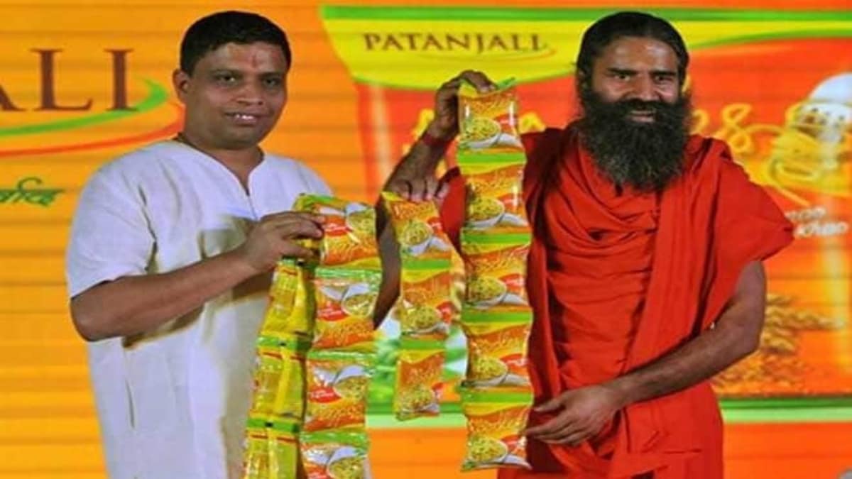 Yoga guru Baba Ramdev (left) with Acharya Balkrishna, co-founder and managing director of Patanjali Ayurved Ltd (Right)