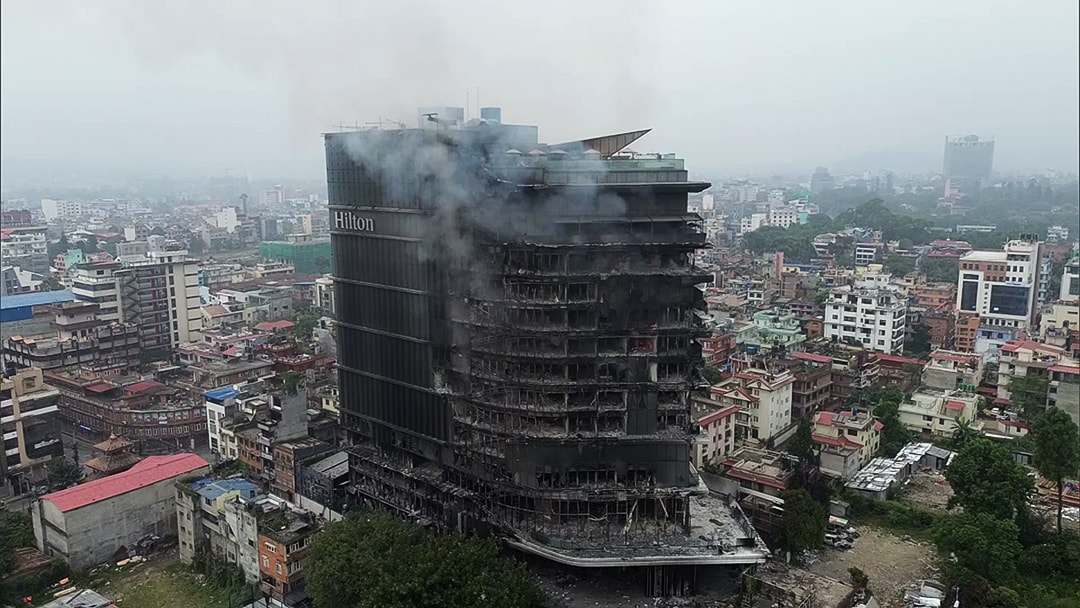 Dramatic visuals shared online showed flames pouring of the windows as protesters raged across the city (ANI video grab)