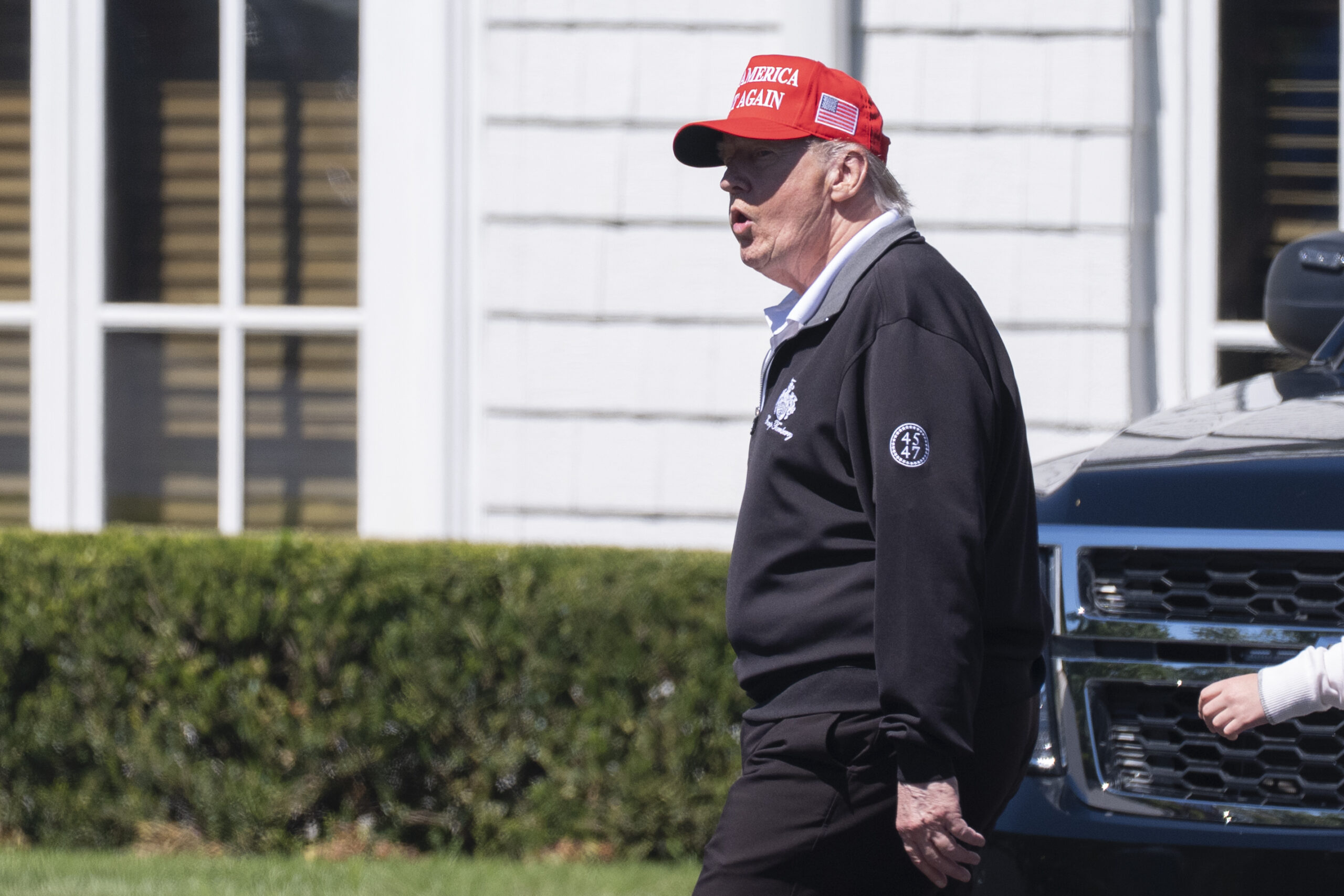 President Donald Trump walks at the Trump National Golf Club in Sterling on August 30 amid rumours about his ill health (AP Photo)