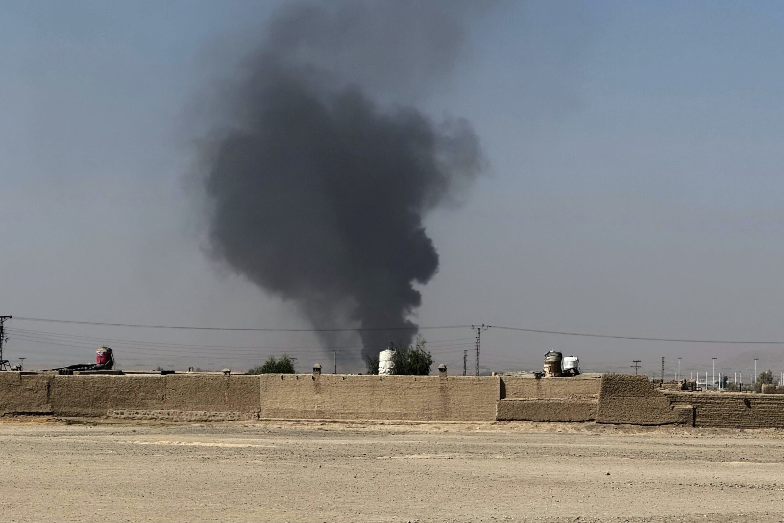 Smoke goes up after a shell exploded in a border area during clashes between Pakistan and Afghan forces, as seen from Pakistan side of the border near Chaman, Pakistan, Wednesday, Oct. 15, 2025. (AP Photo/H. Achakzai)